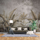 Tapet personalizat leaf cu frunze tropicale stilizate in tonuri de auriu patinat si gri pe un fundal cu aspect de fresca designul aduce o atmosfera exotica si sofisticata ideal pentru interioare elegante fresco brassy leaves
