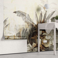 Tapet personalizat leaf cu frunze tropicale stilizate in tonuri de auriu patinat si gri pe un fundal cu aspect de fresca designul aduce o atmosfera exotica si sofisticata ideal pentru interioare elegante warm textured nature