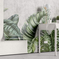 Tapet Personalizat Leaf cu frunze tropicale pe un fundal de perete cimentat - GROWING OVER