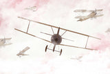 Tapet Personalizat Micii Exploratori cu avioane pe cerul innorat in nuante de roz - PINK SKY BIPLANE